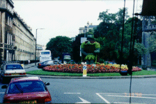A topiary soldier guards a roundabout