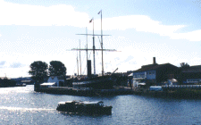 Bristol Harbor; A sailing ship behind a 'narrow boat'